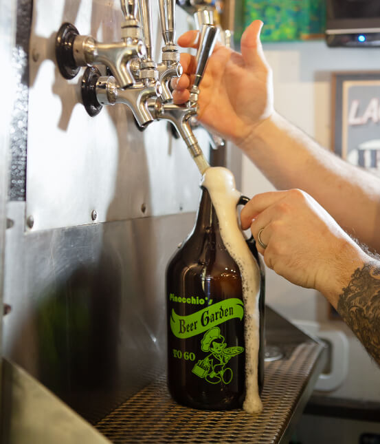 Tap pouring craft beer into a growler